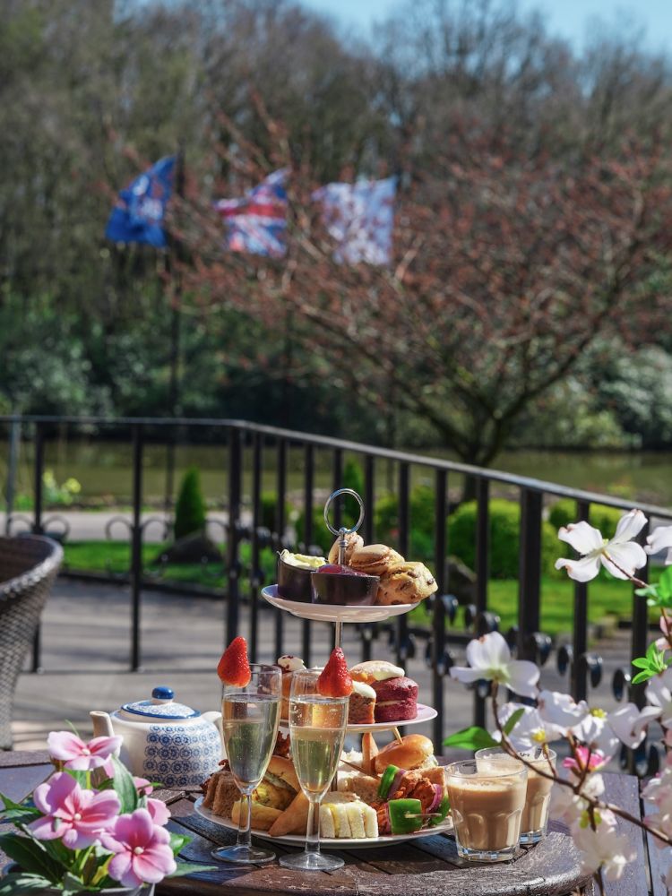 a mumbai afternoon tea set up on the terrace at a hotel in lancashire