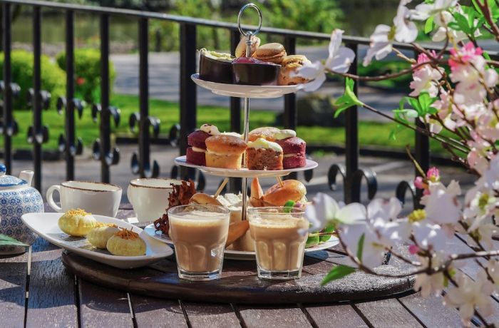 a mumbai afternoon tea set up on the terrace at a hotel in lancashire