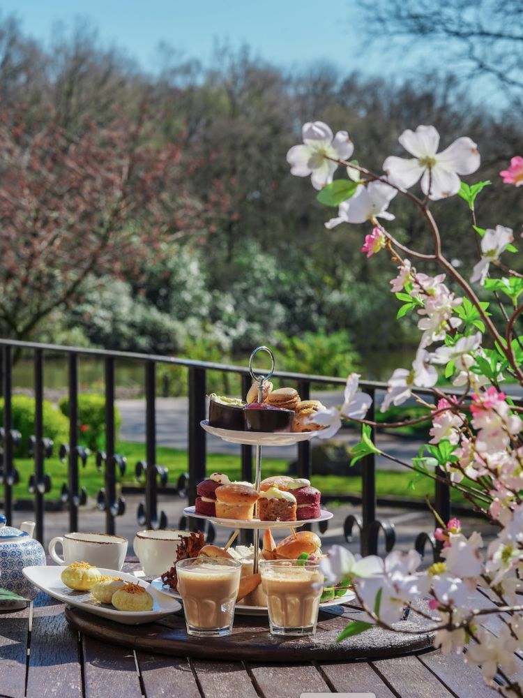 a mumbai afternoon tea set up on the terrace at a hotel in lancashire