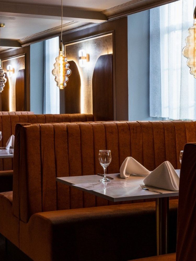 the restaurant with booth seating at a hotel in lancashire