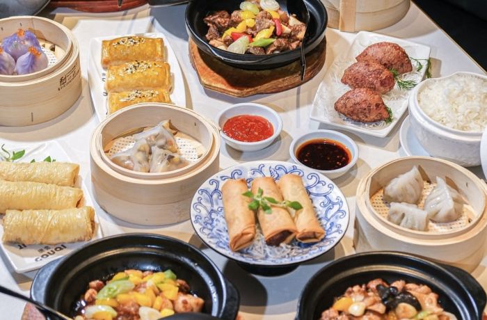 table full of chinese dishes for a three course lunch menu at a chinese restaurant in london