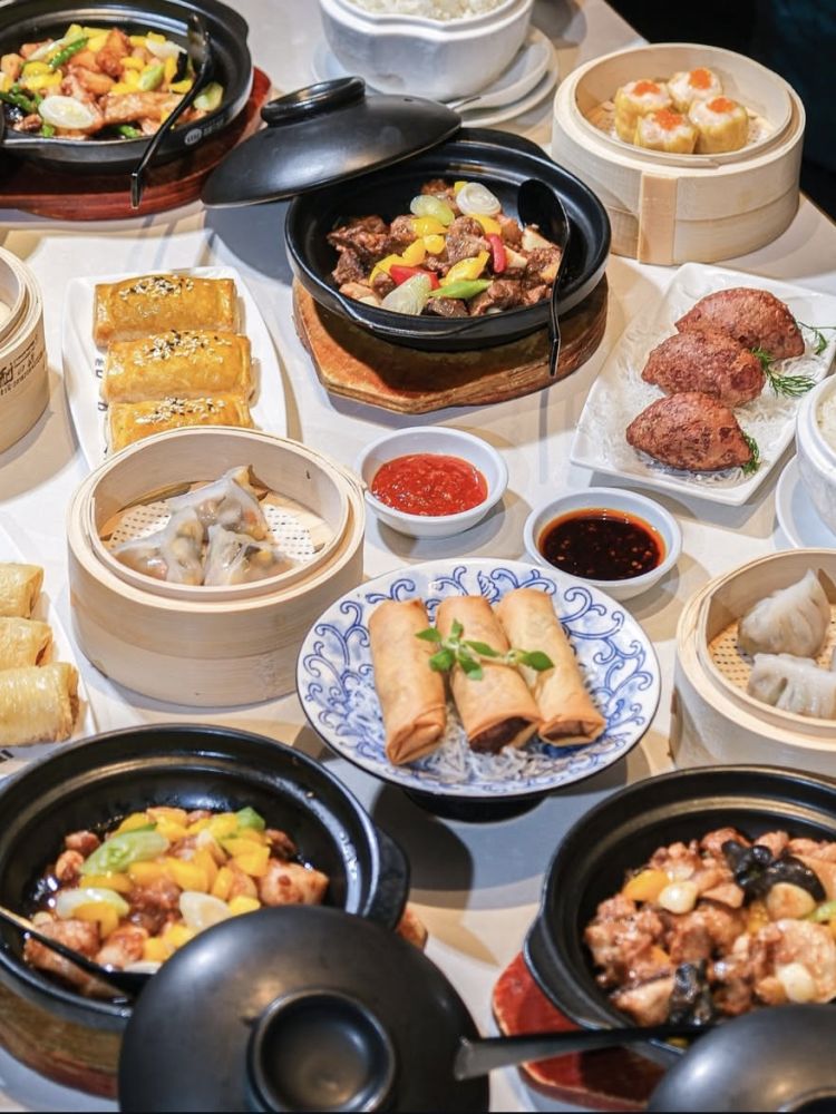 table full of chinese dishes for a three course lunch menu at a chinese restaurant in london