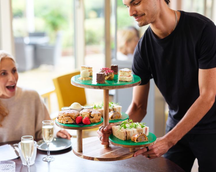 afternoon tea being served at a hotel golf and spa resort in suffolk