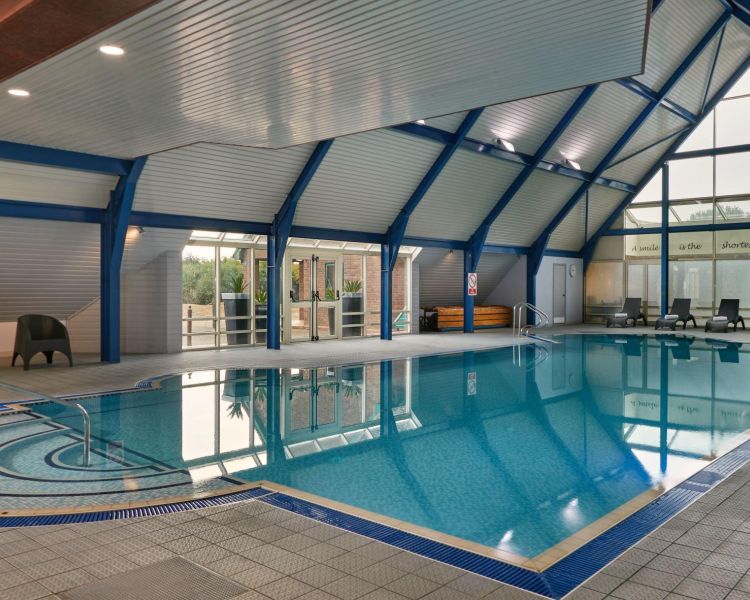 the indoor spa swimming pool at a hotel golf and spa resort in suffolk