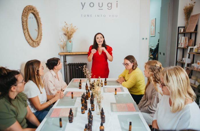 host talking to the group on a perfume making workshop in london