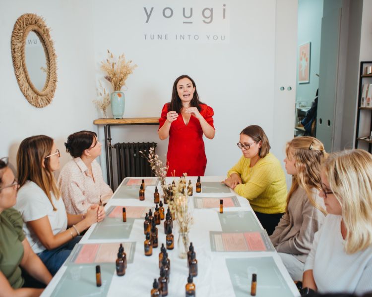 host talking to the group on a perfume making workshop in london