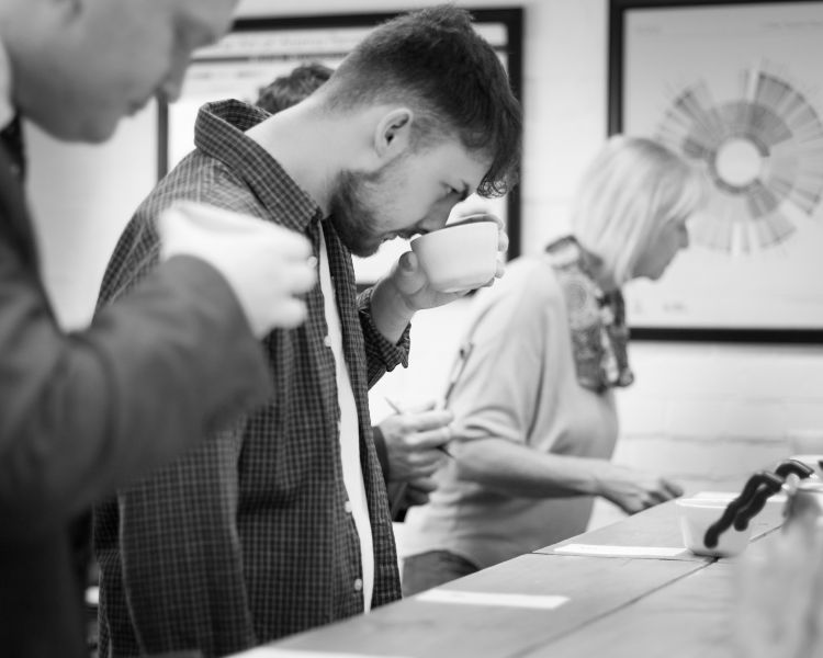 people tasting coffee on a create your own coffee blend experience