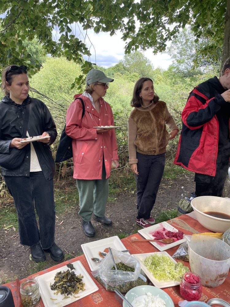 People making pizzas on a foraging experience on hackney marshes
