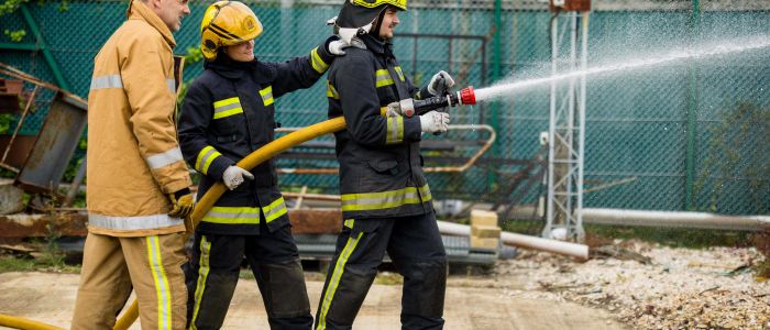 Holding a water hose firefighter experience min
