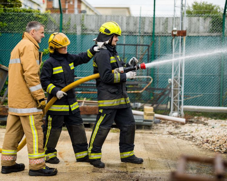 Holding a water hose firefighter experience min