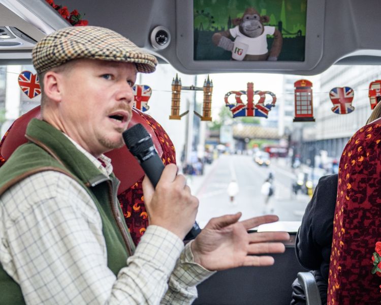Tour guide on a pg tips afternoon tea tour bus in london