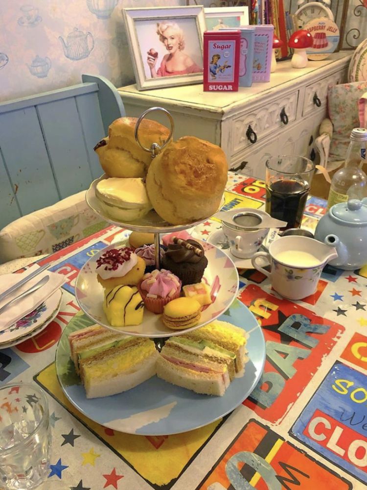 Afternoon tea in a themed room at lion rock tea rooms