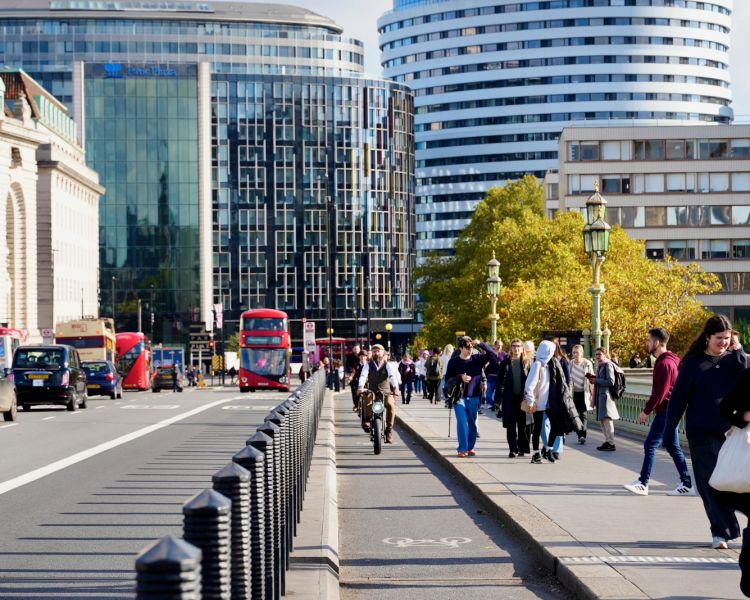 Tour group on ebikes crossing westminster bridge