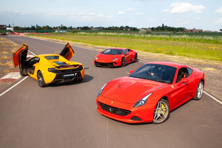 three supercars on a race track for a high speed supercar passenger experience