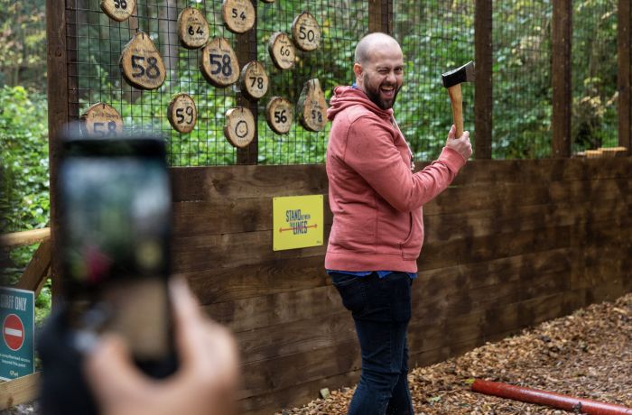 man about to throw an axe at go ape axe throwing experience