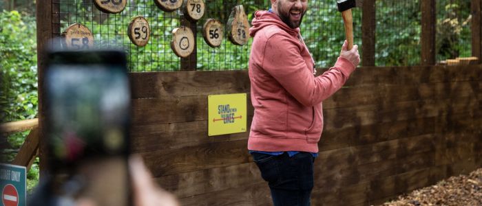 man about to throw an axe at go ape axe throwing experience