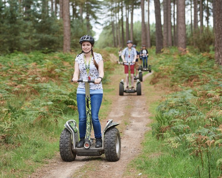 group going through forest on segways at go ape