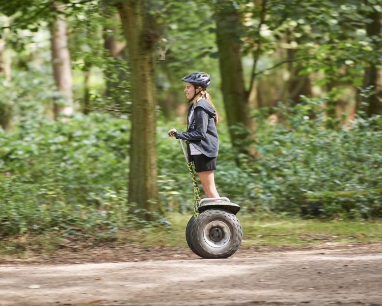 girl on segway through forest at go ape