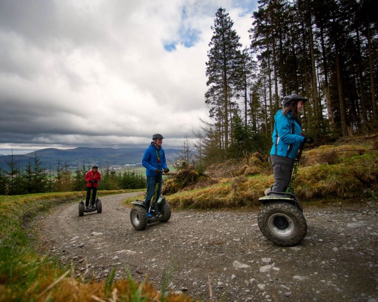 people on forest path on segway experience at go ape