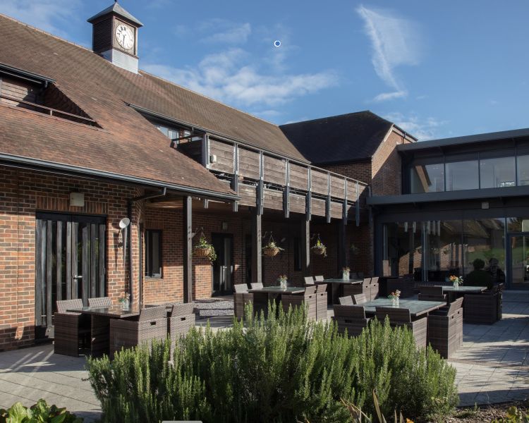 the exterior terrace area of q hotels norton park in winchester