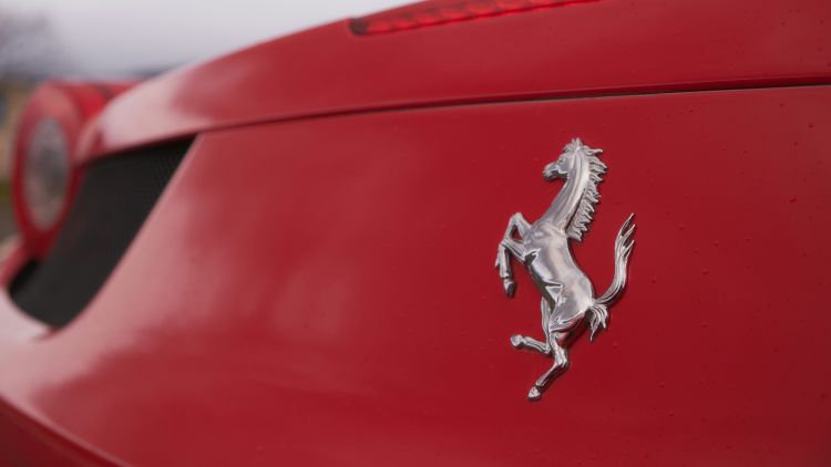 Ferrari badge on back of a red ferrari