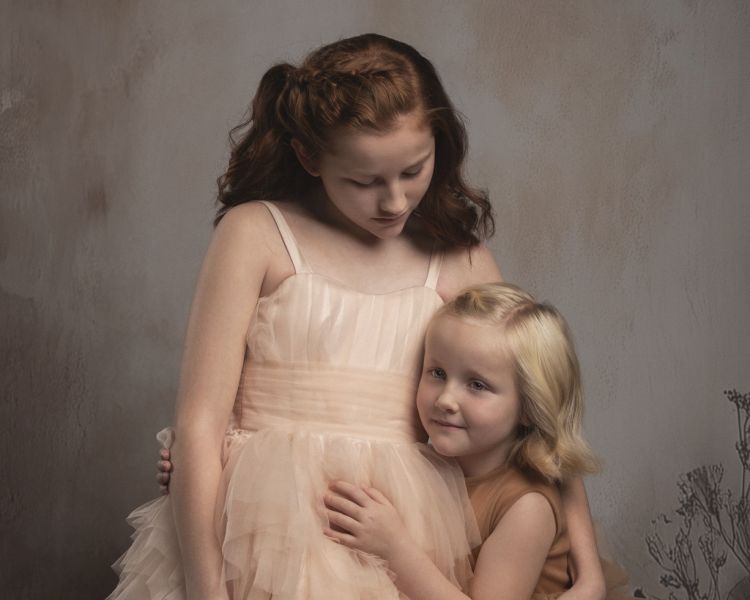 two young sisters on a sibling photoshoot
