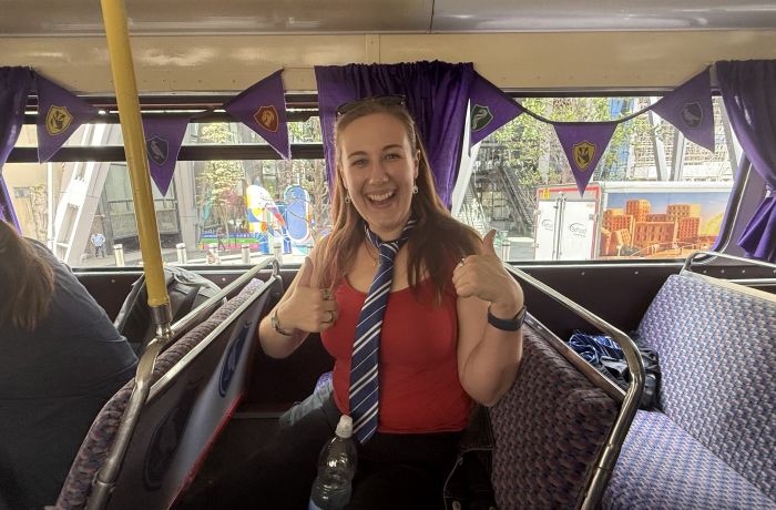 Woman smiling on the harry potter london bus tour