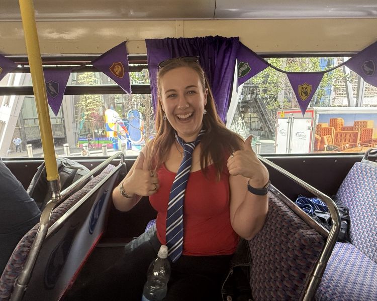 Woman smiling on the harry potter london bus tour