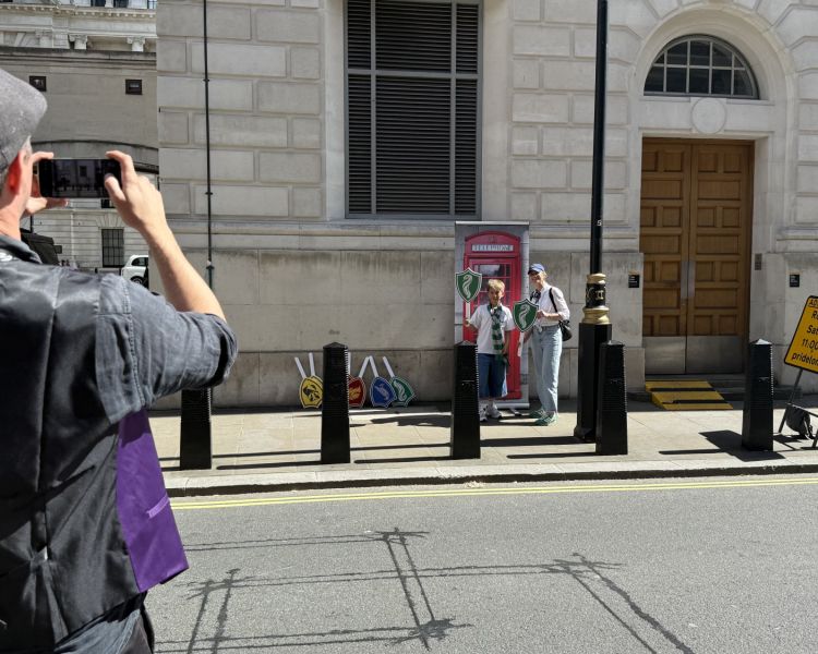 People having photo taken on harry potter london bus tour