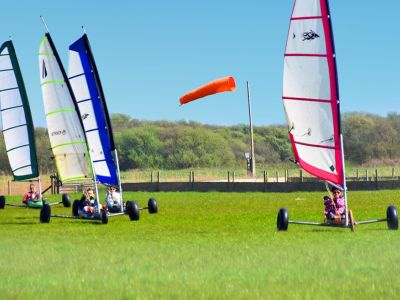 four land yachts on grass for a land yachting for groups experience day