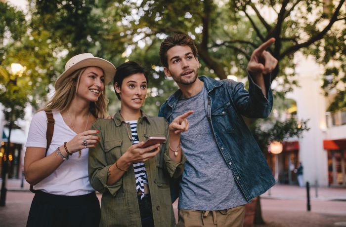 Friends playing game in city