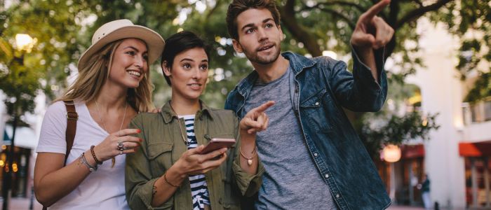 Friends playing game in city