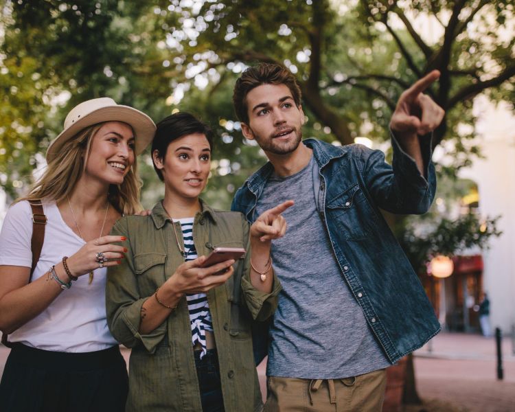 Friends playing game in city