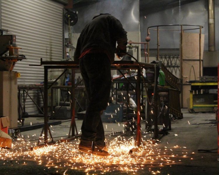 Man welding with sparks flying