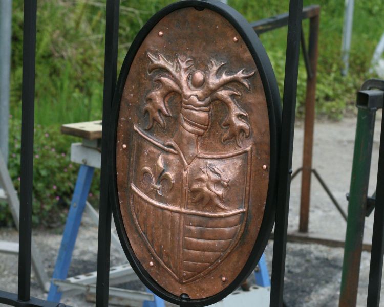 Example of copper repousse design on a gate