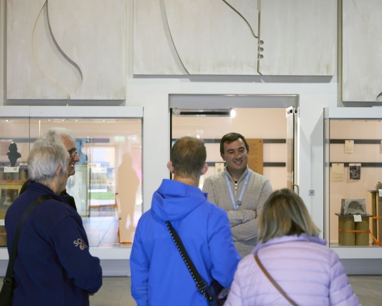 people listening to guide on a guided factory tour at world of wedgwood