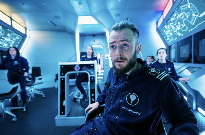 people on an immersive spaceship simulator experience in london