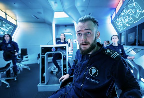 people on an immersive spaceship simulator experience in london