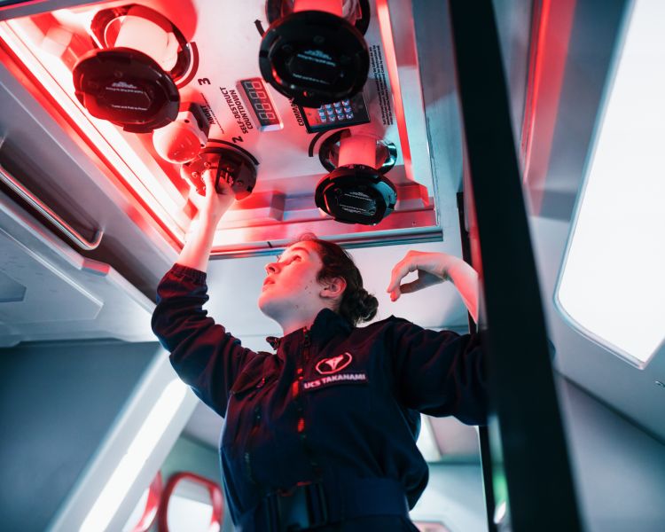 woman acting on spaceship simulator experience in london