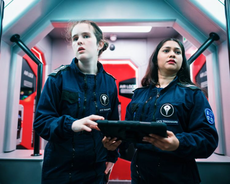 two women acting on spaceship simulator experience in london