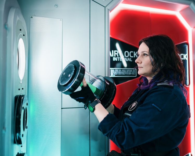 woman acting on spaceship simulator experience in london