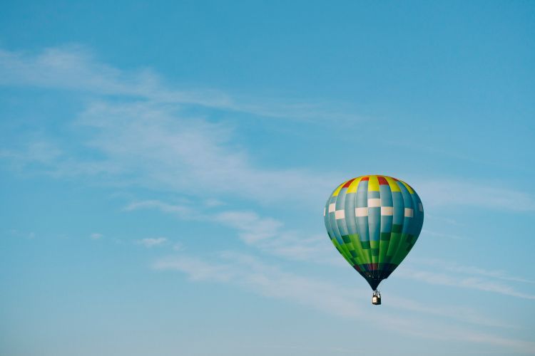 Multi coloured hot air balloon in the sky