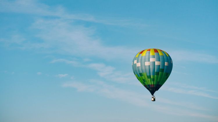 Multi coloured hot air balloon in the sky