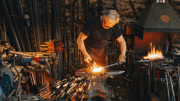 Blacksmith in workshop