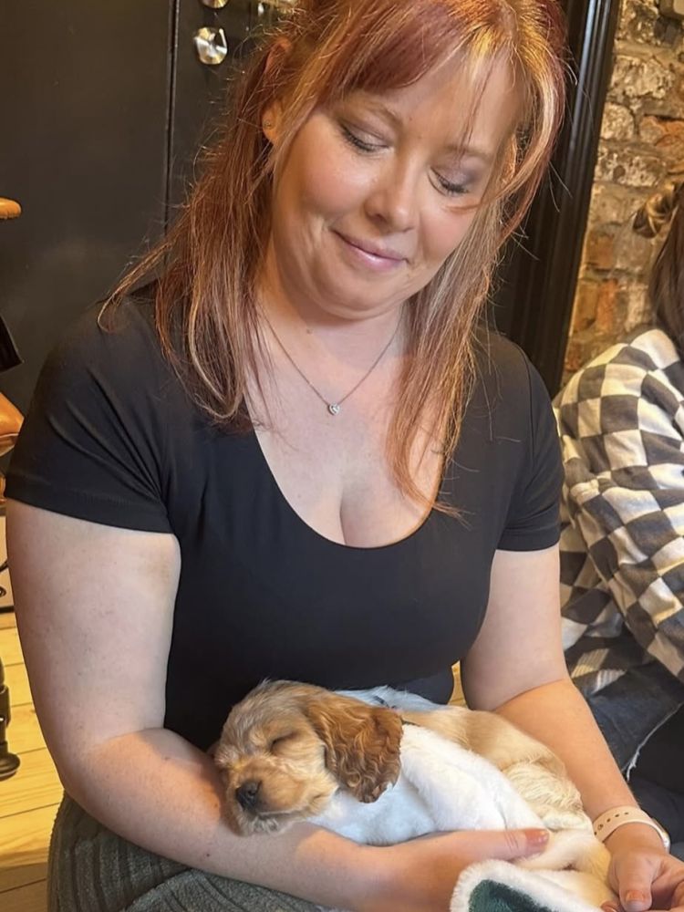 Lady holding a puppy