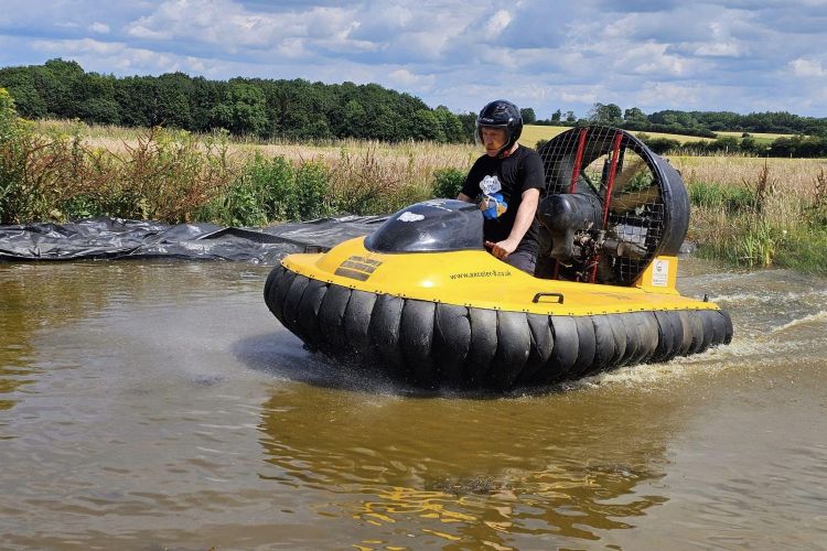 Man in hovercraft on water