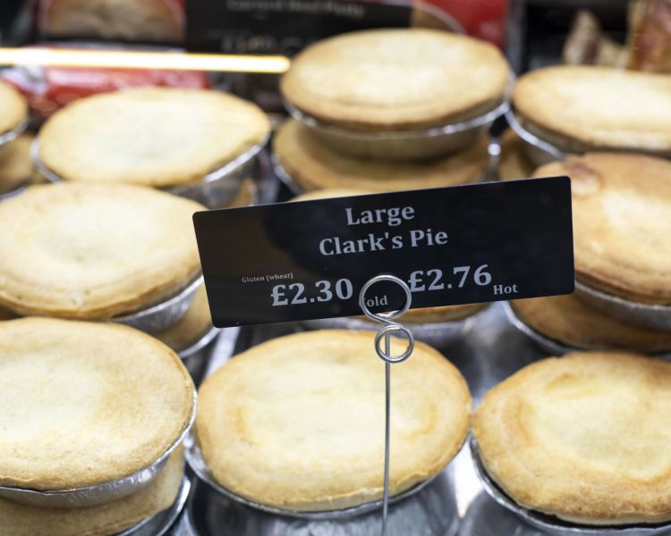 Large clarkes pies in market on welsh food tour