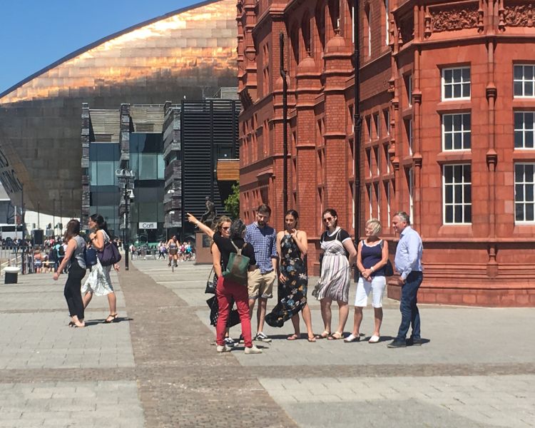 tour group on a cardiff food tour by the pier head and millennium building
