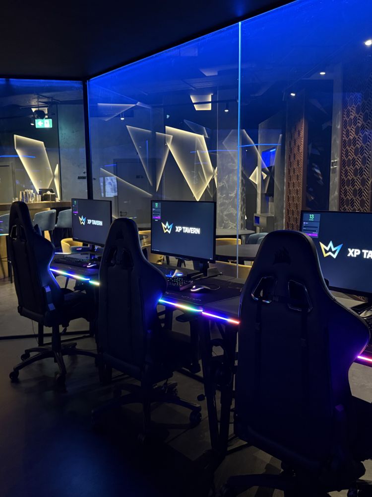 row of pc's at gaming bar in london