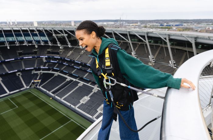 visitor looking out over the pitch on the tottenham hotspur skywalk experience in london